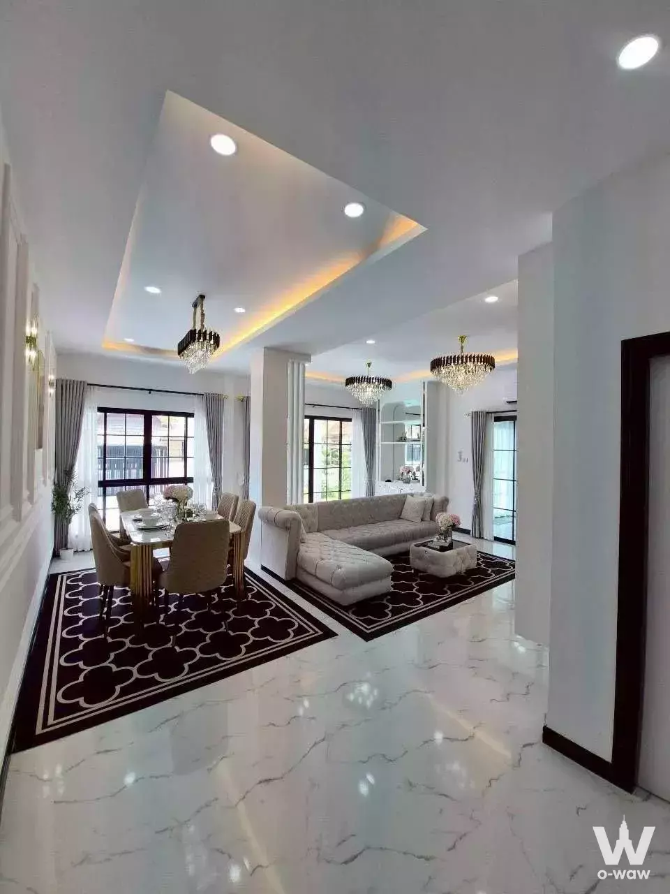 Raviporn City Home Village house living room with marble floors and crystal chandeliers