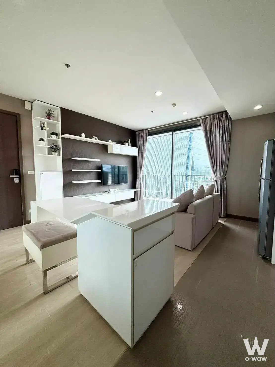 2-bed other for rent in Culture Chula featuring white kitchen island and dark accent wall