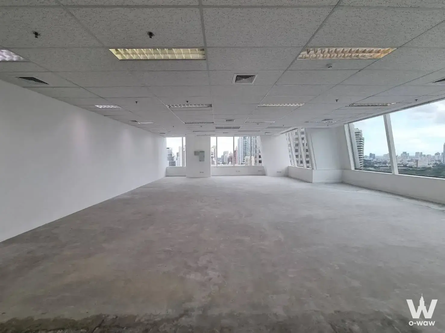 Raw shell office space at Interchange 21 with polished concrete floors and floor-to-ceiling windows
