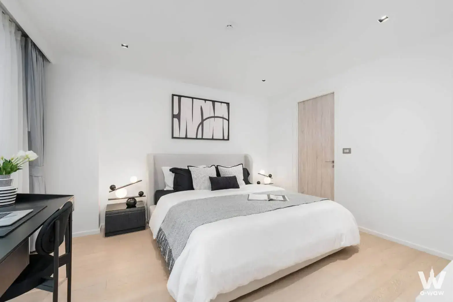 Master bedroom with queen bed and minimalist decor in CRAFT Ploenchit 1-bed condo for sale
