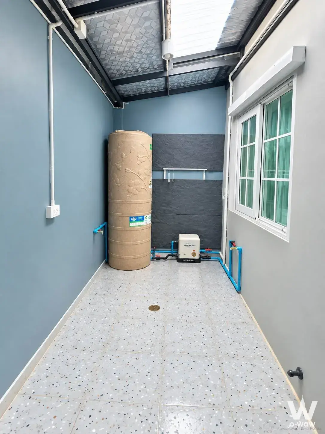 Utility corridor with water tank and plumbing in Golden Town Rama9-krungthepkritha townhouse