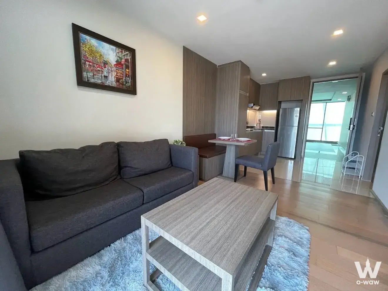 Open-plan living and dining space with kitchen in a 1-bed art @ Thonglor condo