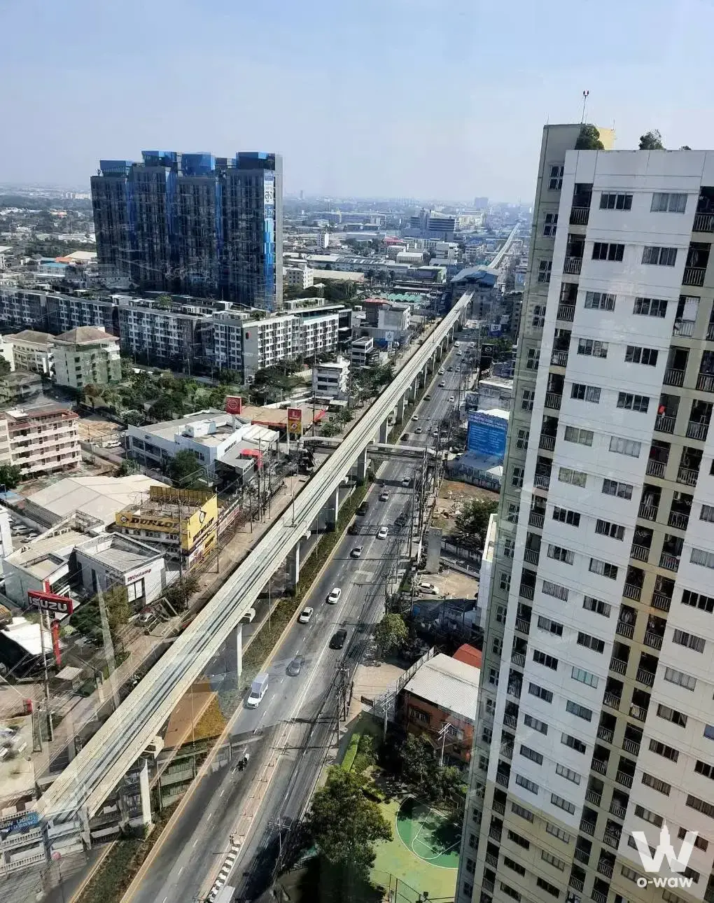 High-floor city view from Lumpini Condotown Ramintra showing elevated tracks and busy roads
