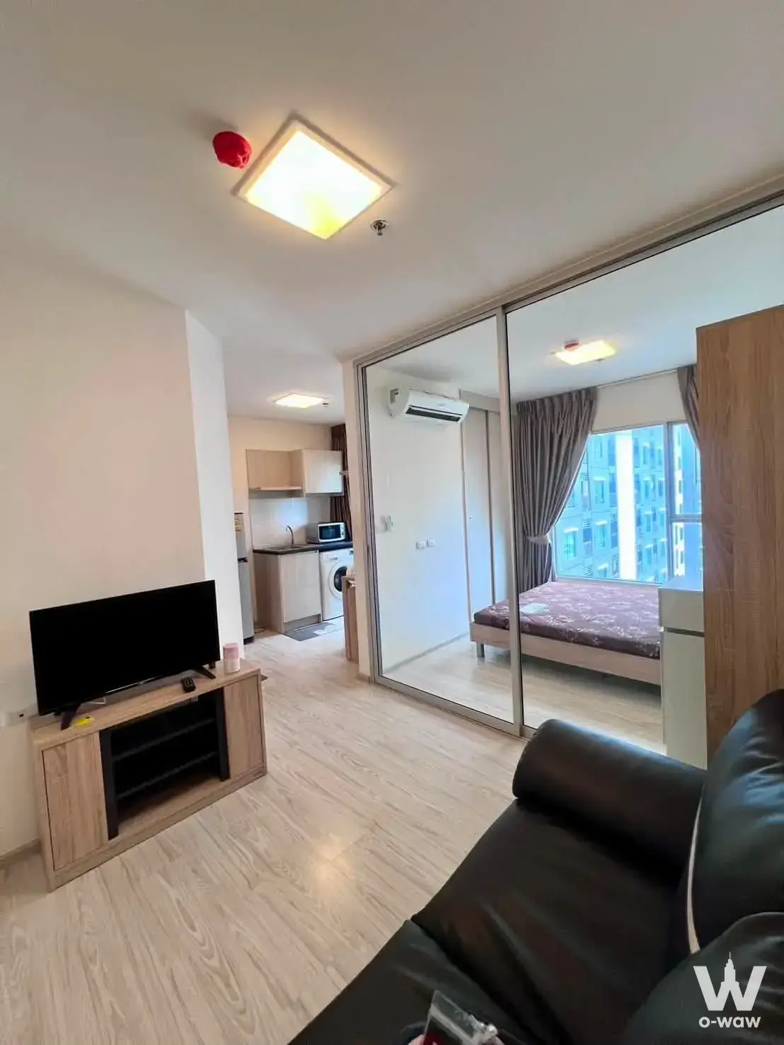 Fully furnished studio apartment in ASPIRE Rattanathibet 2 with open-plan layout and high-rise views