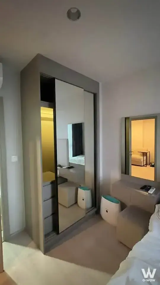 The Privacy Tha Phra Interchange 1-bed condo bedroom with grey wardrobe and teal accent lighting