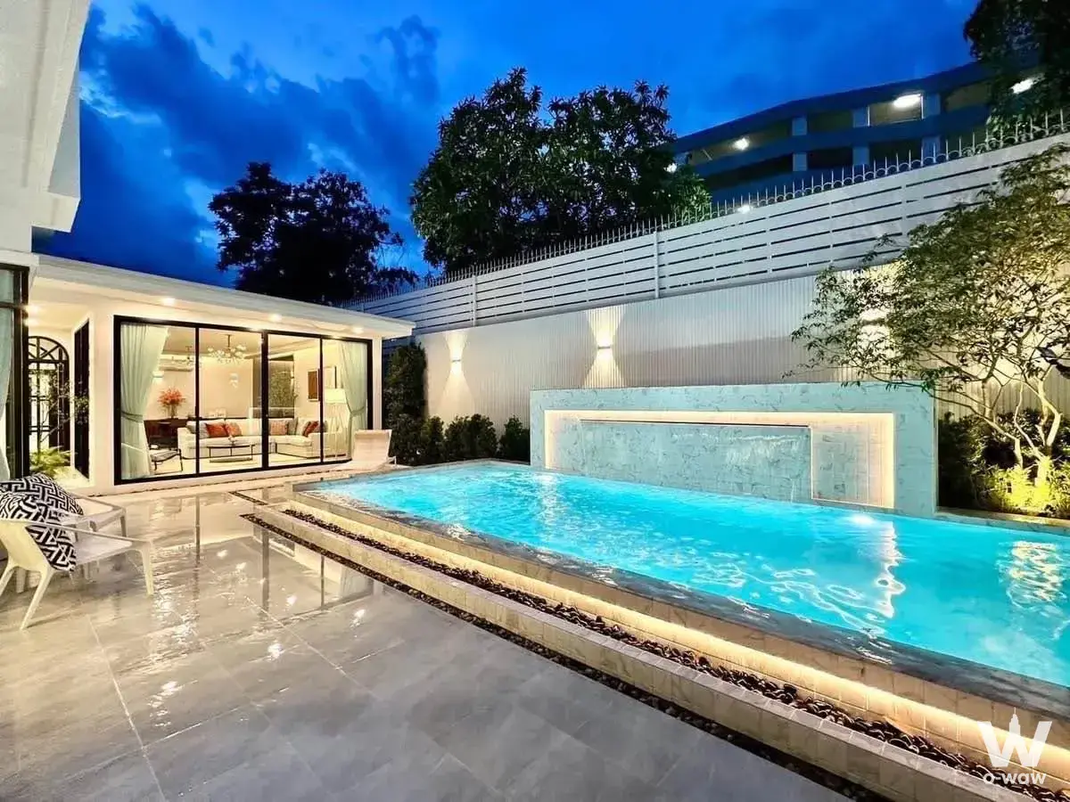 Perfect Masterpiece Sukhumvit 77 nighttime pool villa with turquoise water
