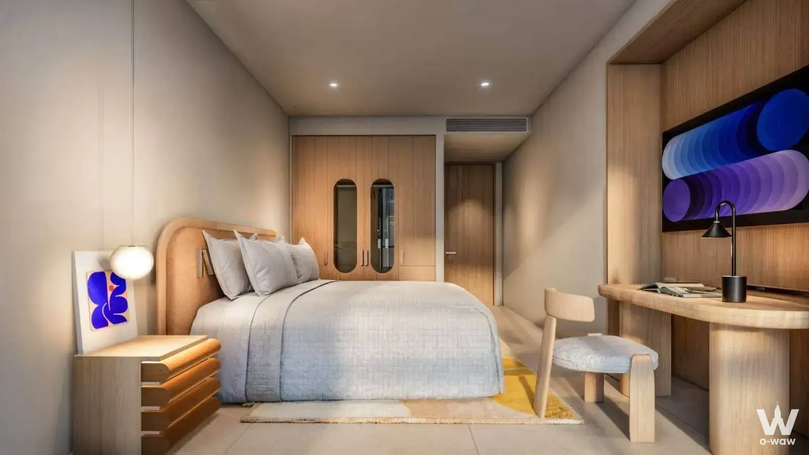 Queen bed with curved headboard in modern Phuket condo bedroom