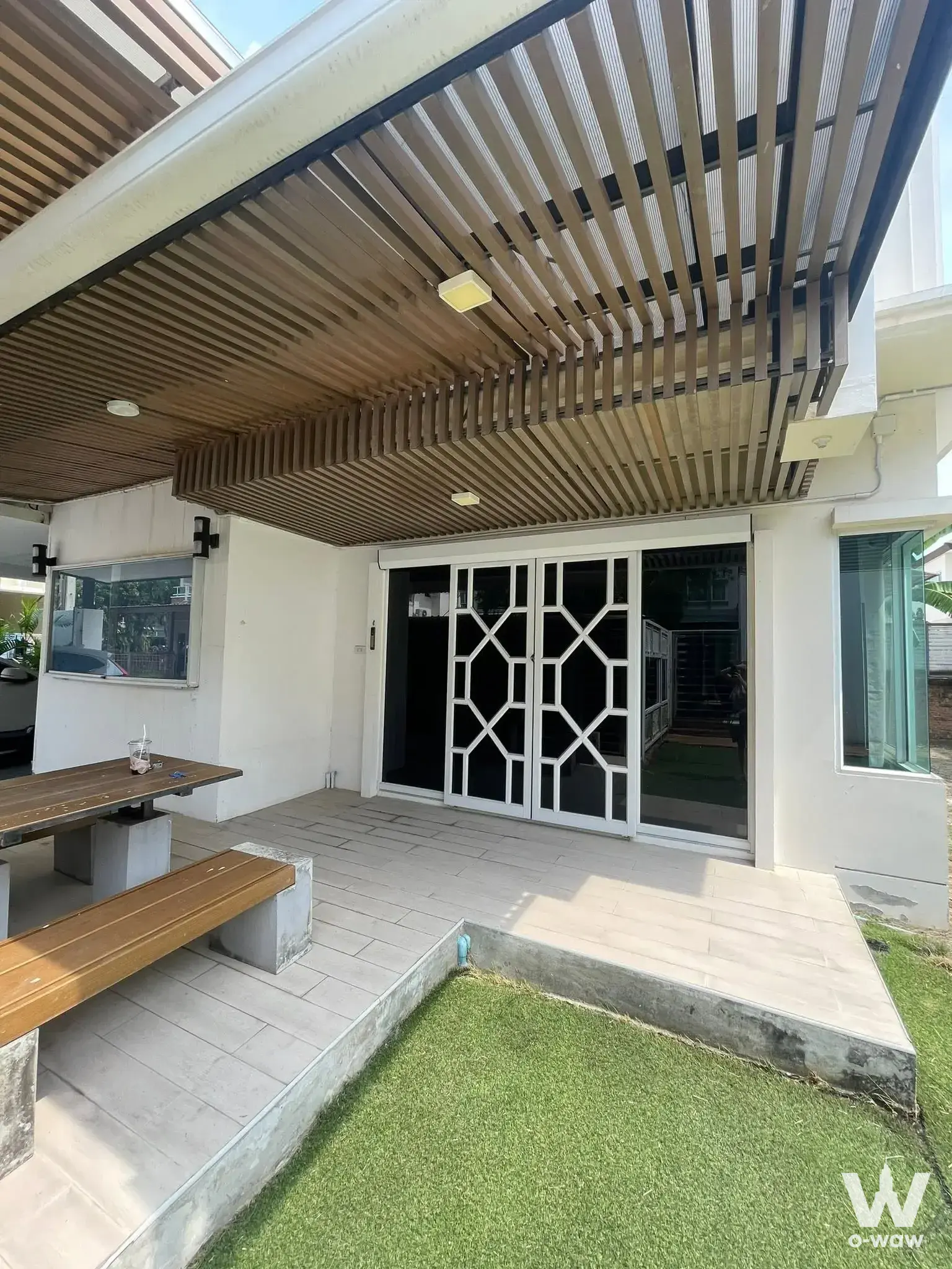 4-bed house for sale in Le Neo I-II with covered terrace, wooden pergola, and dining area