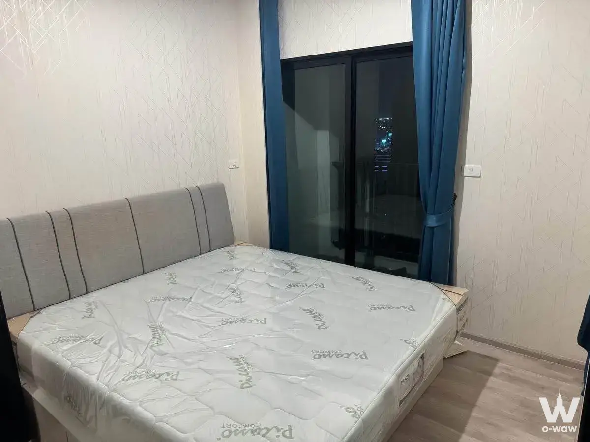 Unfurnished bedroom in Niche MONO Bang Na with floor-to-ceiling glass door