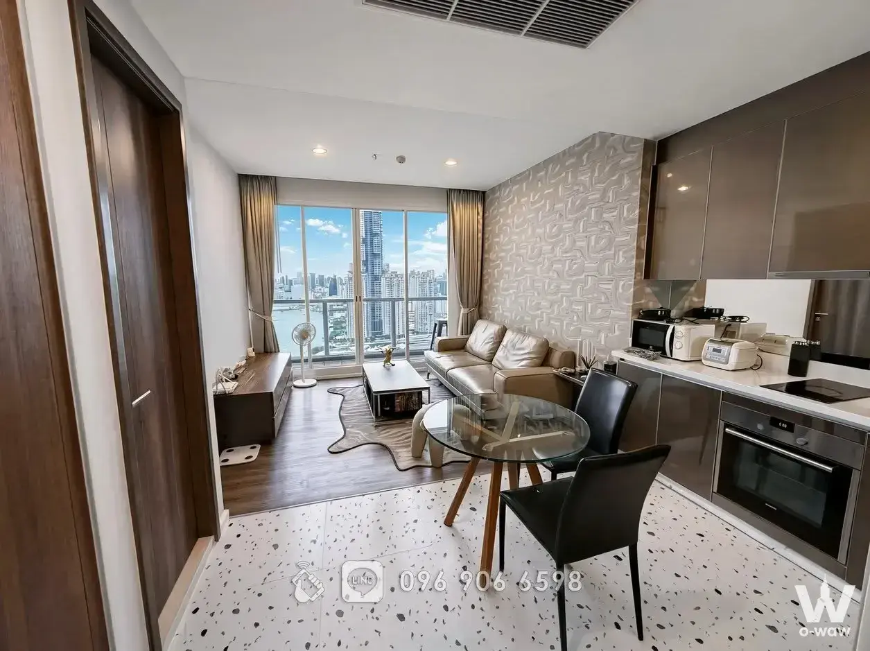 Menam Residences one-bed condo living area with river view and modern kitchen