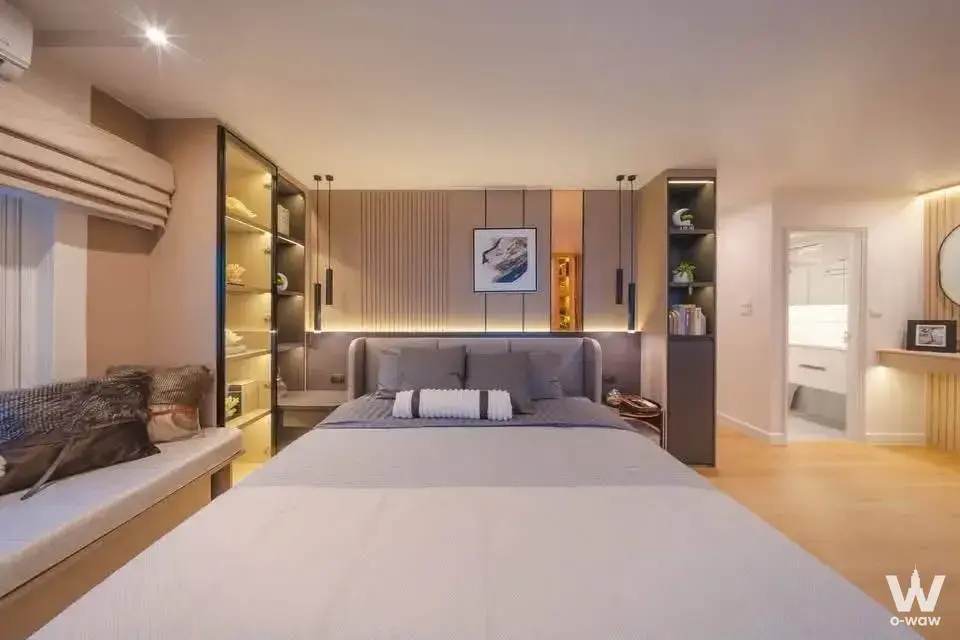 Fortune CondoTown Narathiwas master bedroom with LED-lit shelving, wood slat wall, and window seat