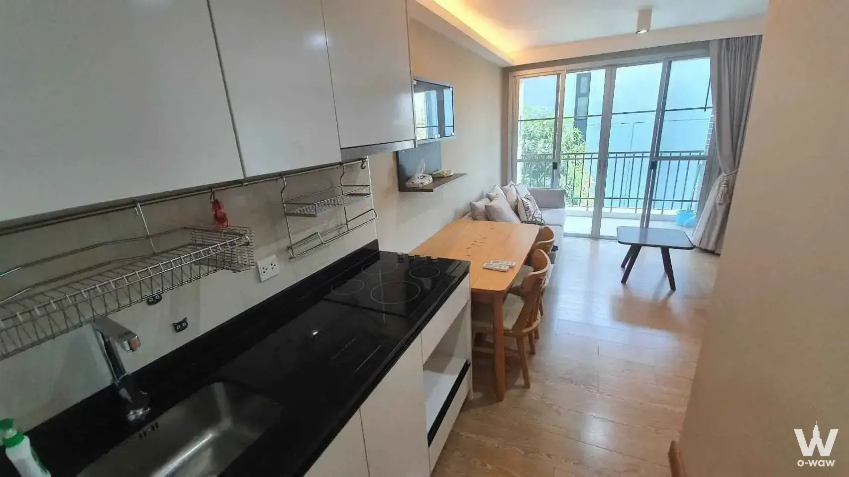 The open-plan 2-bed Maestro 39 condo in Sukhumvit 39 has a black granite counter and balcony