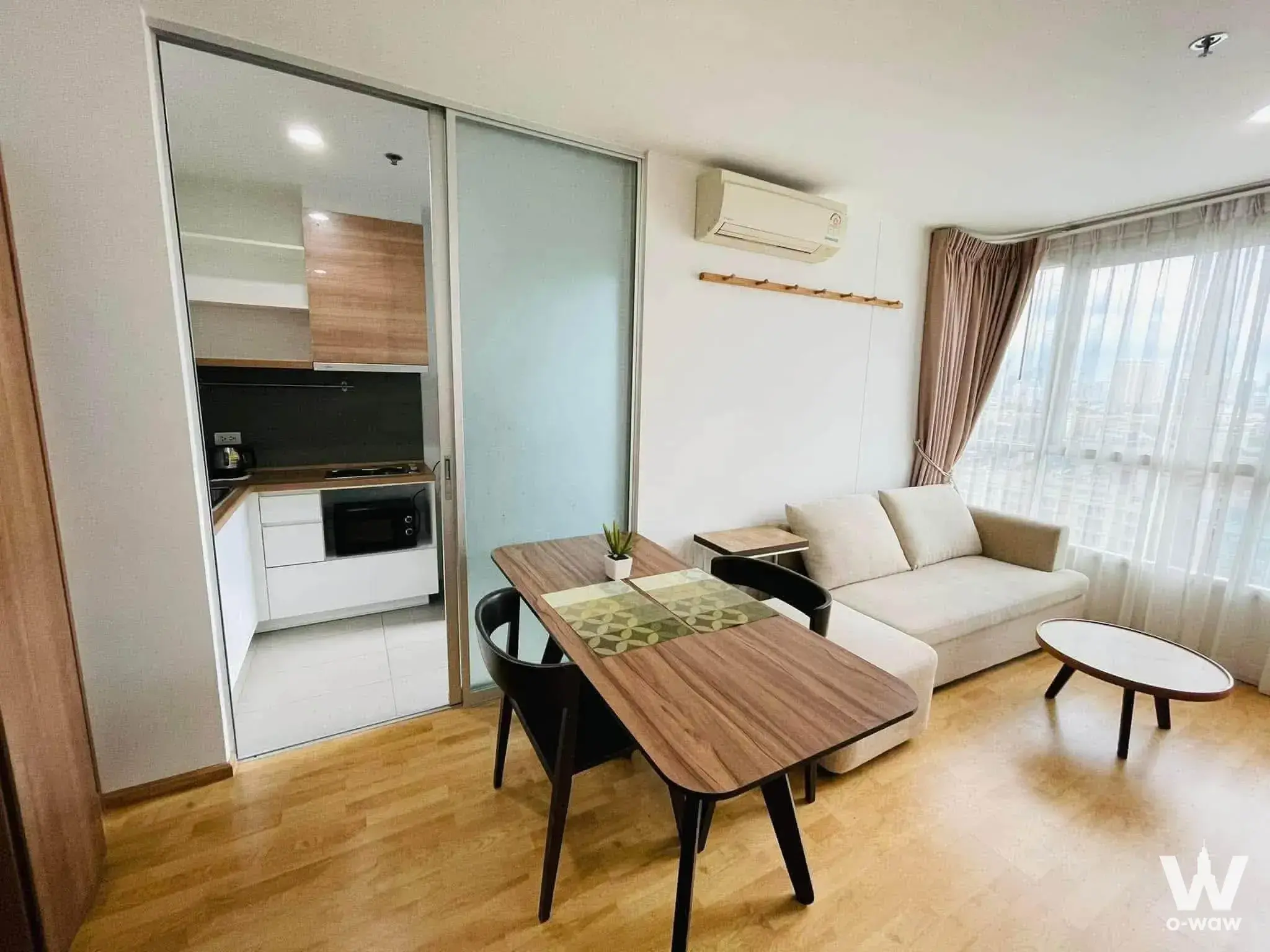 1-bed condo for sale in U Delight Residence Phatthanakan with open-plan living area and city view