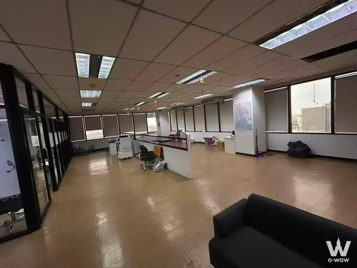 0-bed commercial office for rent in Bangna Complex Tower with glass partitions, city skyline view, and utilitarian layout
