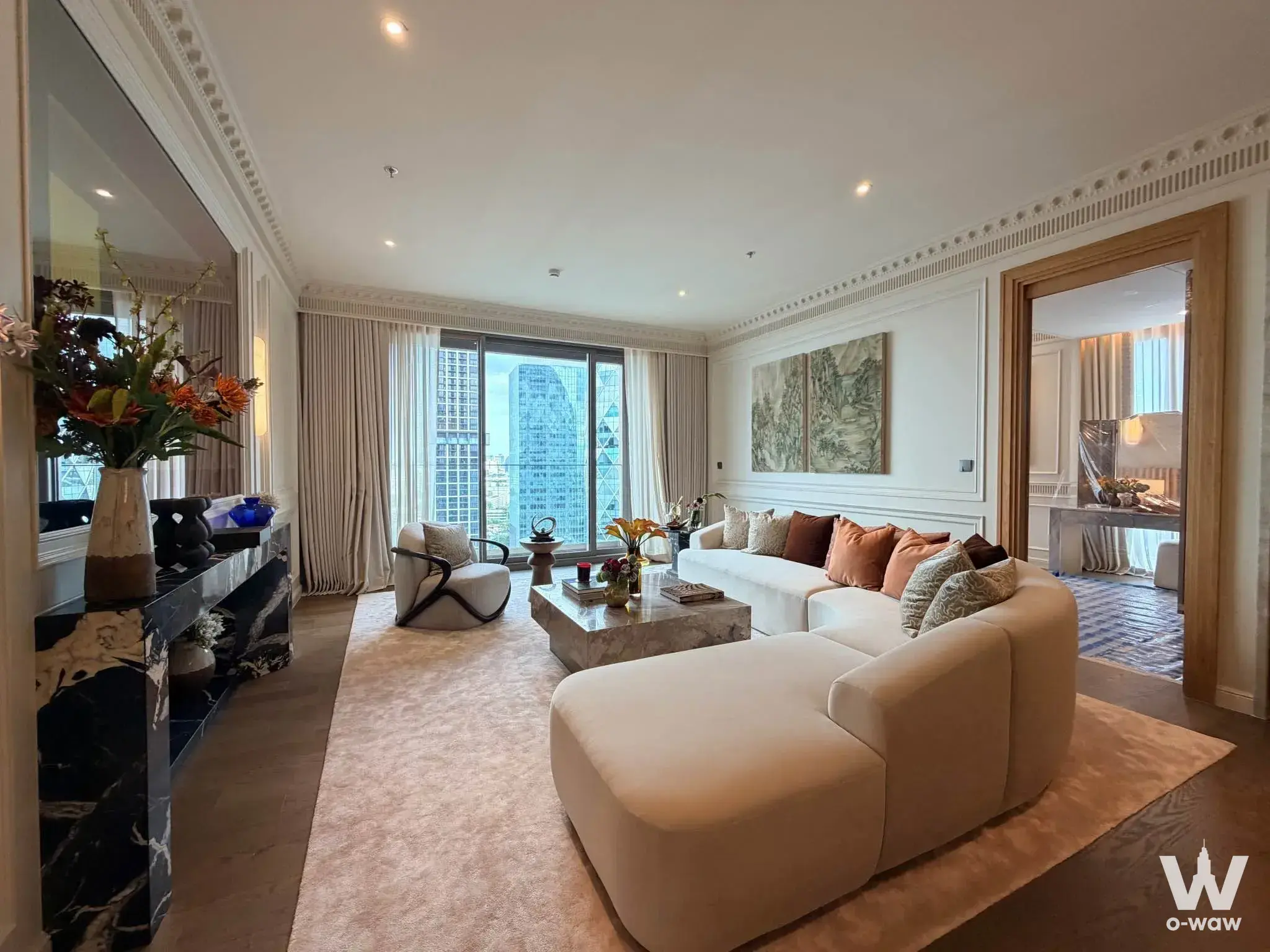 Via Ari 3-bed condo luxury living room with L-shaped sofa and floor-to-ceiling windows