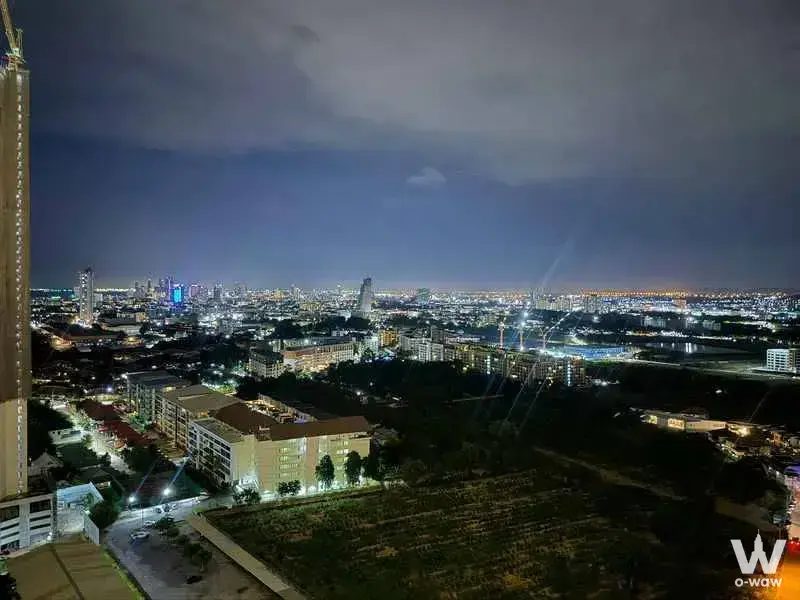 Nighttime cityscape view from a 1-bed condo for rent in The Riviera Ocean Drive showing dense urban lights and distant