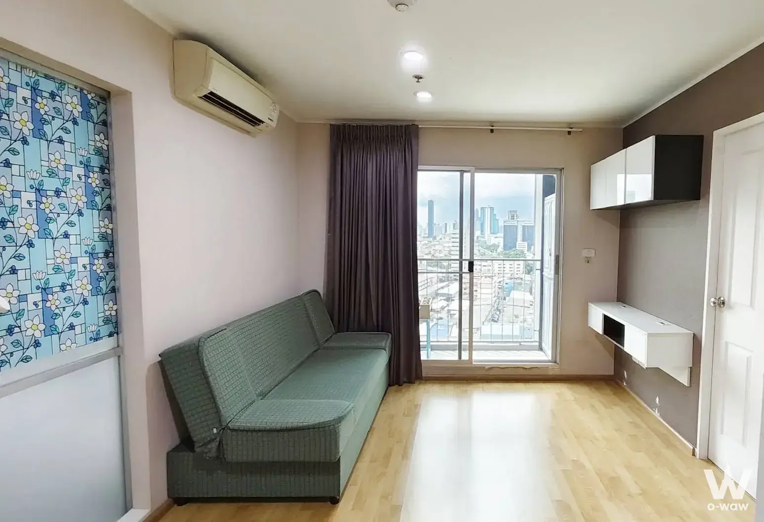 1-bed condo for sale in U Delight Residence with a light-green sofa and city view
