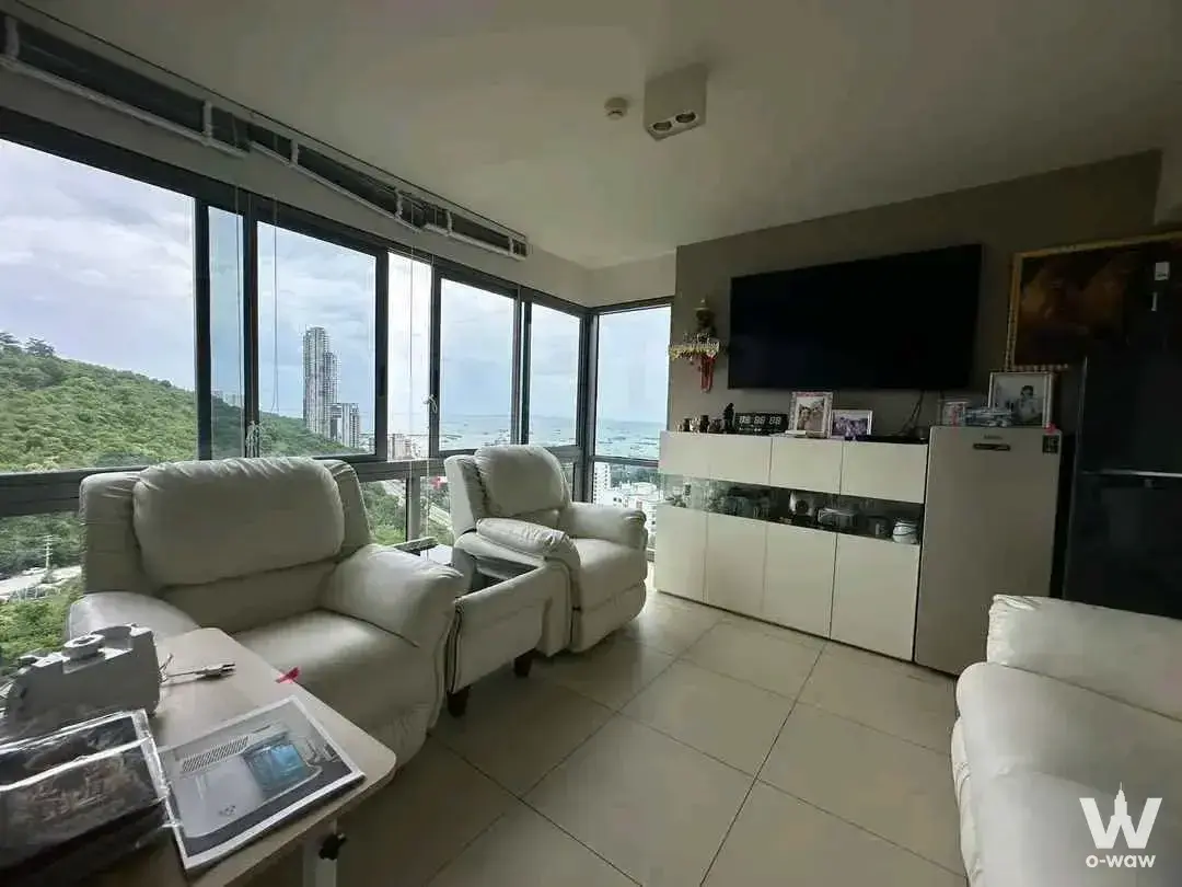 Bright living room with sea views in a 2-bed Unixx South Pattaya condo for sale