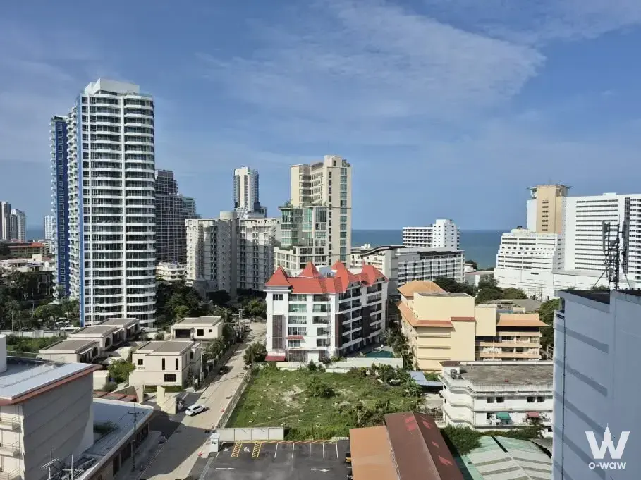 High-rise city view of ocean and buildings from a 1-bed condo for sale in Sky Residences Pattaya