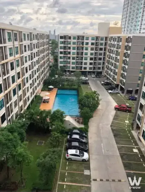 Resort-style pool and towers view from a high floor at Supalai Cute Ratchayothin