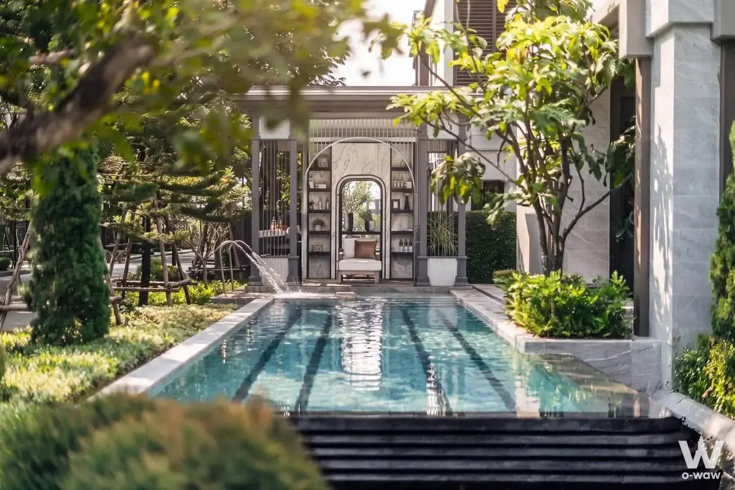 6-bed house for sale in Grand Bangkok Boulevard Borommaratchonnani showcases a luxury pool with a central arched pavilion