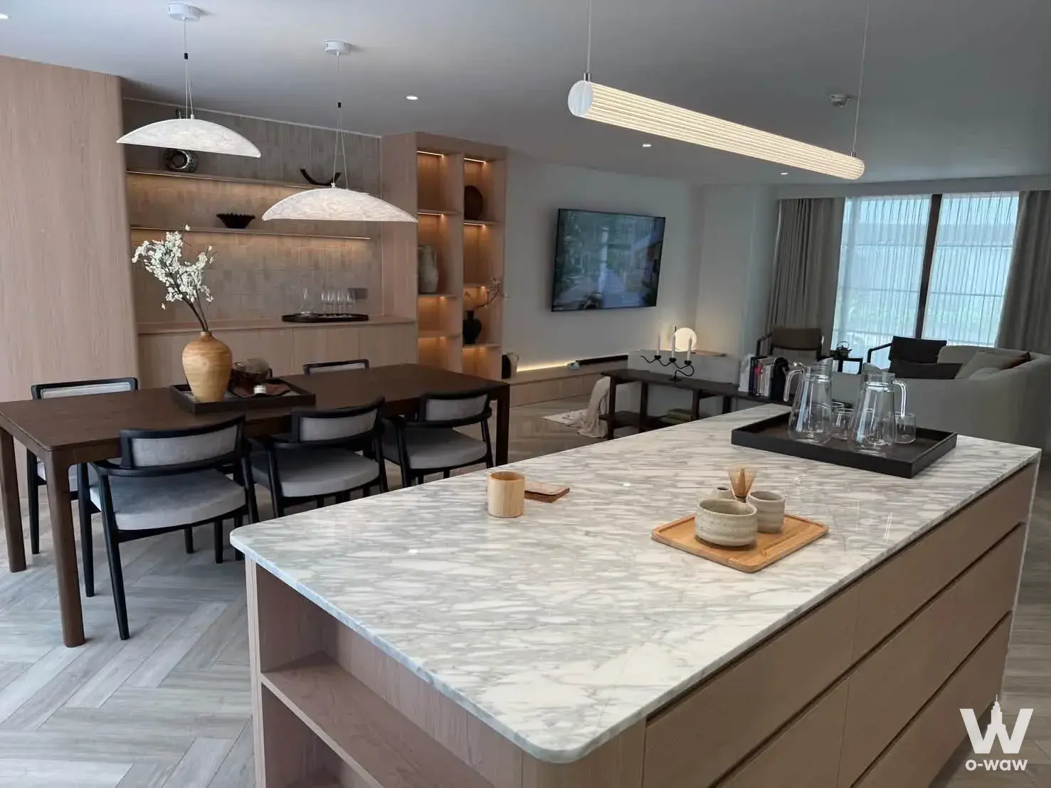Staged 3-bed condo for sale in Supalai Place Sukhumvit 39 featuring a marble kitchen island
