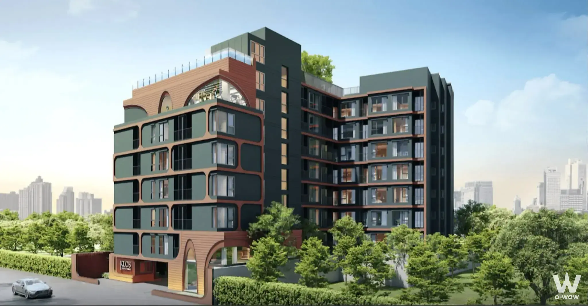 Modern condo exterior with green facade, arched entrance, and rooftop terrace at KLOS Ratchada7
