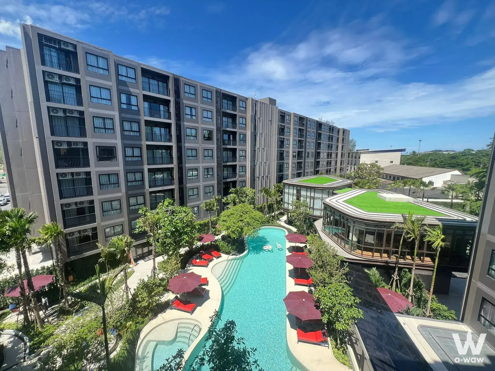 Resort-style turquoise pool and sun loungers at The Base Cherngtalay