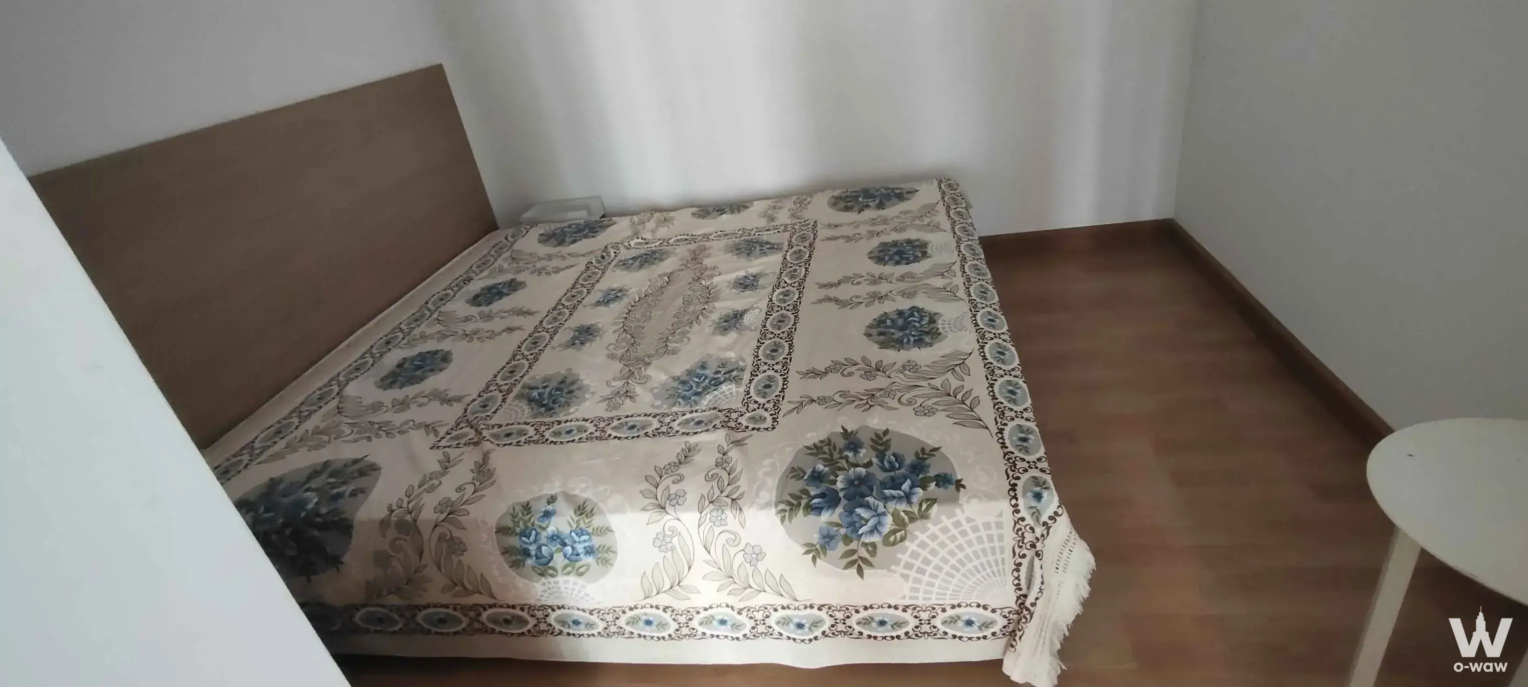 Compact bedroom for sale in City Home Rattanathibet with floral bedspread and wood flooring