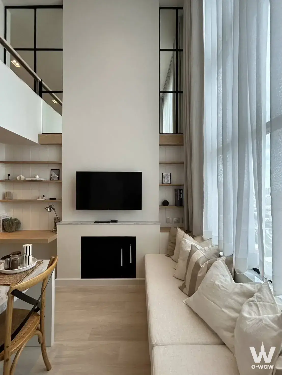 Bright 1-bed condo for rent in KnightsBridge Prime Sathon featuring a double-height living room with modern loft style
